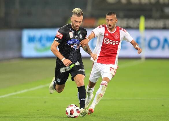 SOCCER - UEFA CL quali, Sturm vs Ajax GRAZ,AUSTRIA,01.AUG.18 - SOCCER - UEFA Champions League qualification, SK Sturm Graz vs AFC Ajax Amsterdam. Image shows Peter Zulj (Sturm) and Hakim Ziyech (Ajax). GEPAxpictures xMarioxBuehner