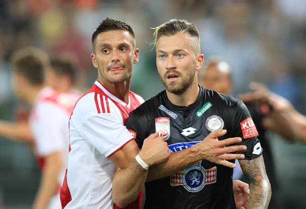 SOCCER - UEFA CL quali, Sturm vs Ajax GRAZ,AUSTRIA,01.AUG.18 - SOCCER - UEFA Champions League qualification, SK Sturm Graz vs AFC Ajax Amsterdam. Image shows Dusan Tadic (Ajax) and Peter Zulj (Sturm). GEPAxpictures xMarioxBuehner