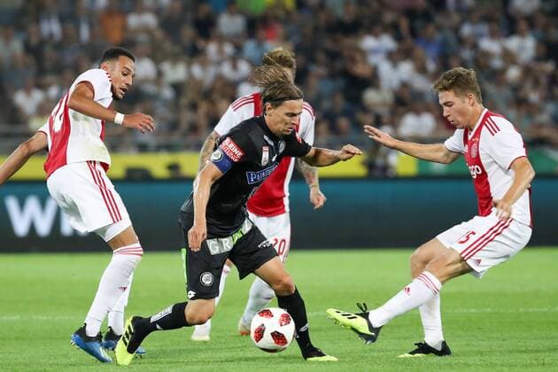 SOCCER - UEFA CL quali, Sturm vs Ajax GRAZ,AUSTRIA,01.AUG.18 - SOCCER - UEFA Champions League qualification, SK Sturm Graz vs AFC Ajax Amsterdam. Image shows Noussair Mazraoui (Ajax), Stefan Hierlaender (Sturm) and Carel Eiting (Ajax). GEPAxpictures xChristianxWalgram