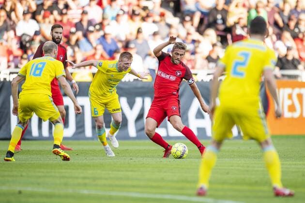 Jakob Poulsen ( 7 - FC Midtjylland ) in action with Laszlo Kleinheisler ( 6 - FC Astana ) during UEFA Champions League, Second Qualifying Round between FC Midtjylland and FC Astana, August 1, 2018 in ARENA Herning, Denmark. Photo: Bo Amstrup Ritzau Scanpix , Herning Denmark  Copyright: BoxAmstrup BoxAmstrupx cop103 spdk20180801-213559-L