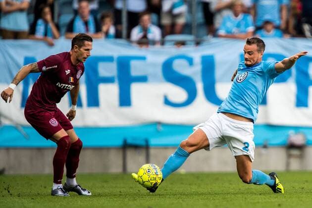 180801 Ciprian Deac or Cluj and Eric Larsson of Malmö FF during the UEFA Champions League qualifying match between Malmö FF and Cluj on August 1, 2018 in Malmö Photo Mathilda Ahlberg BILDBYR N Cop 178  Copyright: MATHILDAxAHLBERG BB180801MA082