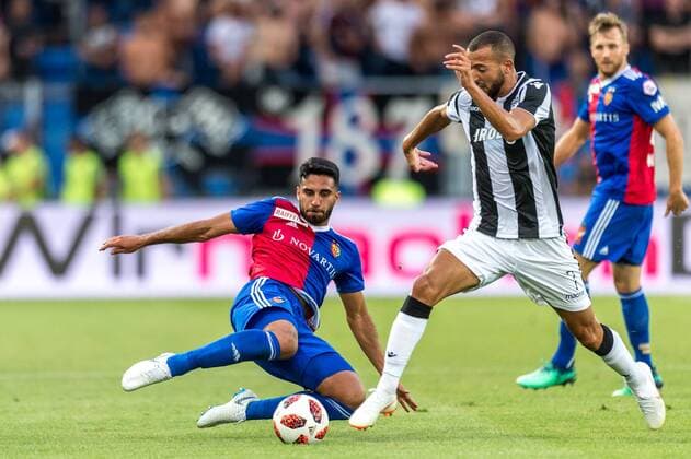 Soccer Champions League Second qualifying round 18 19 FC Basel 1893 PAOK Salonika 01 08 2018 Eray Ervin Cuemart FCB 4 in a duel with Omar El Kaddouri PAOK 7 in Champions League qualifying round 2 Match between FC Basel 1893 and FC PAOK Salonika on Wednesday 01 August 2018 at St Jakob Park in Basel xGRGx