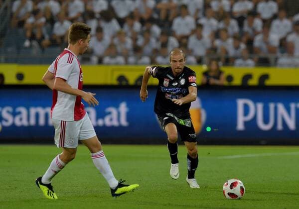 SOCCER - UEFA CL quali, Sturm vs Ajax GRAZ,AUSTRIA,01.AUG.18 - SOCCER - UEFA Champions League qualification, SK Sturm Graz vs AFC Ajax Amsterdam. Image shows Carel Eiting (Ajax) and Fabian Koch (Sturm). GEPAxpictures xMichaelxRiedler