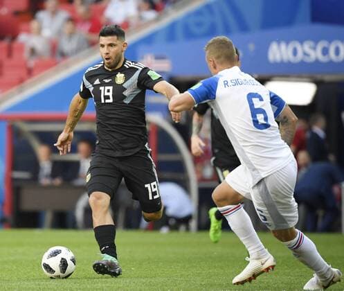 Football: Argentina s Aguero at World Cup Sergio Aguero (19) of Argentina dribbles the ball while being marked by Ragnar Sigurdsson of Iceland during the second half of a 1-1 draw in a World Cup Group D match at Spartak Stadium in Moscow on June 16, 2018. 