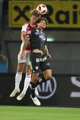 SOCCER - UEFA CL quali, Sturm vs Ajax GRAZ,AUSTRIA,01.AUG.18 - SOCCER - UEFA Champions League qualification, SK Sturm Graz vs AFC Ajax Amsterdam. Image shows Frenkie de Jong (Ajax) and Philipp Hosiner (Sturm). GEPAxpictures xChristianxWalgram