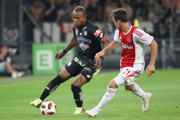 SOCCER - UEFA CL quali, Sturm vs Ajax GRAZ,AUSTRIA,01.AUG.18 - SOCCER - UEFA Champions League qualification, SK Sturm Graz vs AFC Ajax Amsterdam. Image shows Emeka Friday Eze (Sturm) and Nico Tagliafico (Ajax). GEPAxpictures xChristianxWalgram