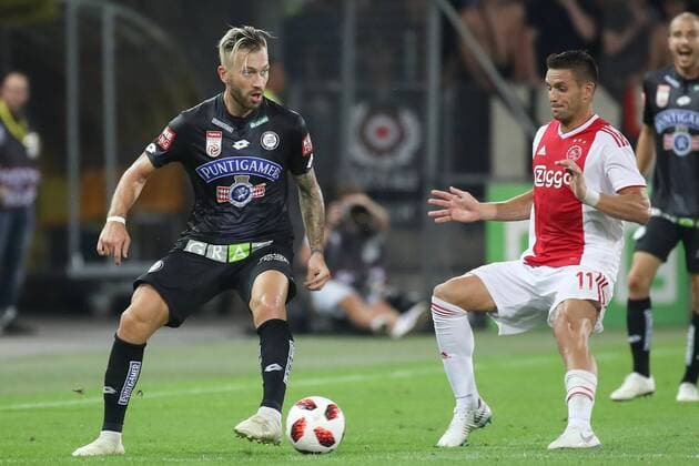 SOCCER - UEFA CL quali, Sturm vs Ajax GRAZ,AUSTRIA,01.AUG.18 - SOCCER - UEFA Champions League qualification, SK Sturm Graz vs AFC Ajax Amsterdam. Image shows Peter Zulj (Sturm) and Dusan Tadic (Ajax). GEPAxpictures xChristianxWalgram