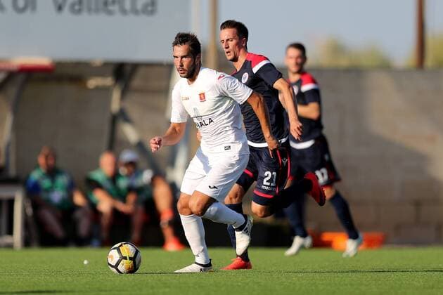 Santiago Malano (L) of Valletta FC speeds away from the challenge of Marko PeriÅ¡iÄ‡ (21) HÅ K Zrinjski during the UEFA Europa League, second Qualifying Round, second leg match between Valletta FC and HÅ K Zrinjski at the Centenary Stadium, Ta Qali, Malta on 02 August, 2018. Valletta FC v HÅ K Zrinjski UEL_18_19