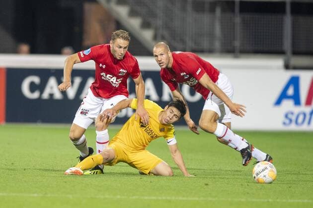 ALKMAAR , 02-08-2018 , AFAS Stadion ,season 2018 2019, Football, 2nd round Europa League qualification . AZ player Teun Koopmeiners , FC Kairat player Bauyrzhan Islamkhan and AZ player Ron Vlaar during the match AZ - FC Kairat AZ - FC Kairat  x2373283x