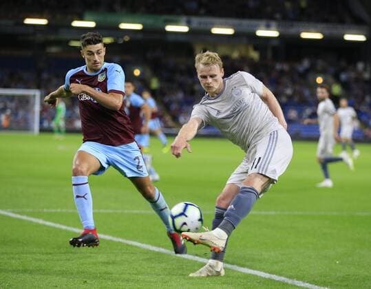 2nd August 2018, Turf Moor, Burnley, England; UEFA Europa League qualification, second qualifying round, 2nd leg, Burnley versus Aberdeen; Gary Mackay-Steven of Aberdeen clears the ball up the line under pressure from Matthew Lowton of Burnley  ActionPlus12052133 ConorxMolloy