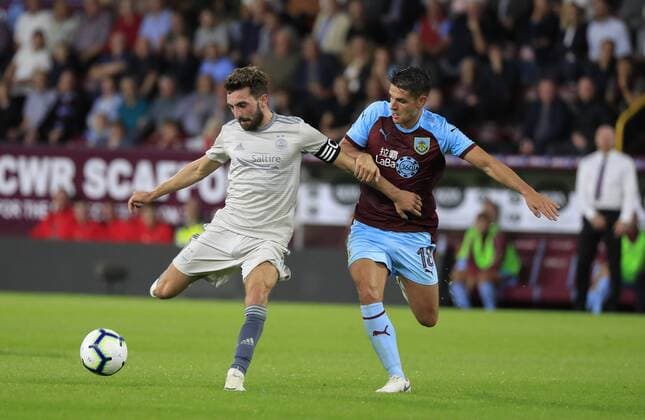 2nd August 2018, Turf Moor, Burnley, England; UEFA Europa League qualification, second qualifying round, 2nd leg, Burnley versus Aberdeen; Graeme Shinnie of Aberdeen is challenged by Ashley Westwood of Burnley  ActionPlus12052136 ConorxMolloy