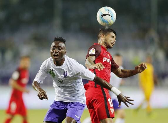 BUDAPEST, HUNGARY - AUGUST 2: (l-r) Obinna Nwobodo of Ujpest FC competes for the ball with Ever Banega of Sevilla FC during the UEFA Europa League Second Qualifying Round 2nd Leg match between Ujpest FC and Sevilla FC at Ferenc Szusza Stadium on August 2, 2018 in Budapest, Hungary. LaszloxSzirtesi 