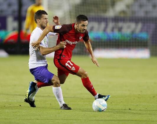 BUDAPEST, HUNGARY - AUGUST 2: (l-r) Bojan Sankovic of Ujpest FC competes for the ball with Pablo Sarabia of Sevilla FC during the UEFA Europa League Second Qualifying Round 2nd Leg match between Ujpest FC and Sevilla FC at Ferenc Szusza Stadium on August 2, 2018 in Budapest, Hungary. LaszloxSzirtesi 