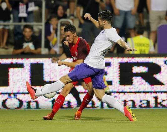 BUDAPEST, HUNGARY - AUGUST 2: (l-r) Sebastien Corchia of Sevilla FC competes for the ball with Daniel Nagy of Ujpest FC during the UEFA Europa League Second Qualifying Round 2nd Leg match between Ujpest FC and Sevilla FC at Ferenc Szusza Stadium on August 2, 2018 in Budapest, Hungary. LaszloxSzirtesi 