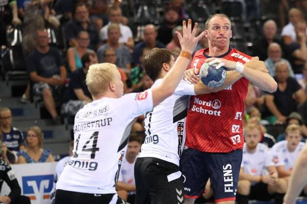 17 Jacob Cement Cup Handball Test match 03 08 18 Holger Glandorf SG Flensburg Handewitt 09 against Magnus Saugstrup Aalborg Handbold 14 and Tobias Ellebaek Aalborg Handbold 17 xmmkx