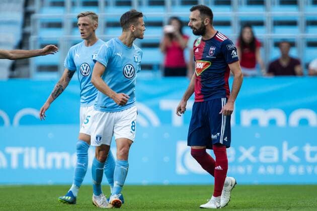 180807 Arnor Ingvi Traustason or Malmö FF in a discussion with Attila Fiola or Vidi during the UEFA Champions League qualifying match between Malmö FF and Vidi on August 7, 2018 in Malmö Photo Mathilda Ahlberg BILDBYRAN Cop 178  Copyright: MATHILDAxAHLBERG BB180807MA046