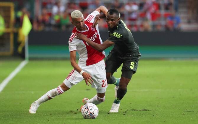 Standard s Collins Fai and Ajax Hakim Ziyech fight for the ball during the soccer match between Belgian Standard de Liege and Dutch AFC Ajax Amsterdam, Tuesday 07 August 2018 in Liege. This is the first leg of the third qualifying round of the UEFA Champions League. VIRGINIExLEFOUR  x05400409x