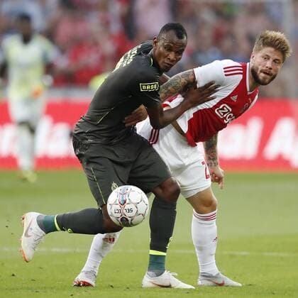 LIEGE, 07-08-2018 , Stadium Maurice Dufrasne, football season 2018 2019, UEFA Champions League third qualifying round, 1st leg , Ajax player Lasse Schone (R) and Standard player Uche Agbo (L) during the game Standard Luik - Ajax . Standard Luik - Ajax  x2382378x