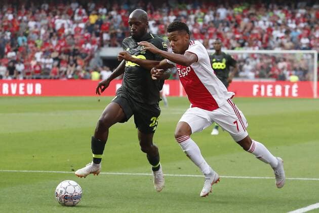 LIEGE, 07-08-2018 , Stadium Maurice Dufrasne, football season 2018 2019, UEFA Champions League third qualifying round, 1st leg , Ajax player David Neres (R) and Standard player Christian Luyindama (L) during the game Standard Luik - Ajax Standard Luik - Ajax  x2382400x