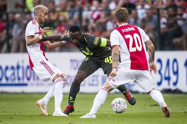 LIEGE, Standard Luik - Ajax, 7-8-2018, football, season 2018-2019, third round qualification match for Champions League, Maurice Dufrasne stadium, Standard Liege player Paul-Jose Mpoku (M), Ajax player Hakim Ziyech (L), Ajax player Lasse Schone (R) Standard Luik - Ajax  x2382433x