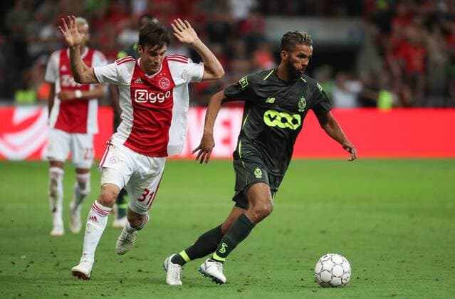 Ajax Nicolas Tagliafico and Standard s Mehdi Carcela fight for the ball during the soccer match between Belgian Standard de Liege and Dutch AFC Ajax Amsterdam, Tuesday 07 August 2018 in Liege. This is the first leg of the third qualifying round of the UEFA Champions League. VIRGINIExLEFOUR  x05400518x