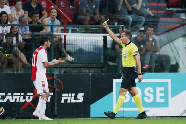 LIEGE, 07-08-2018 , Stadium Maurice Dufrasne, football season 2018 2019, UEFA Champions League third qualifying round, 1st leg , Ajax player Nico Tagliafico (L) receives yellow card during the game Standard Luik - Ajax Standard Luik - Ajax  x2382467x