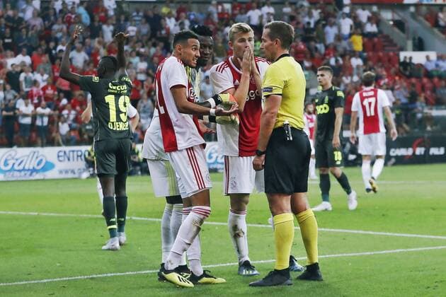 LIEGE, 07-08-2018 , Stadium Maurice Dufrasne, football season 2018 2019, UEFA Champions League third qualifying round, 1st leg , Ajax player Noussair Mazraoui (L) and Ajax player Matthijs de Ligt (C) complaining after given penalty by referee during the game Standard Luik - Ajax Standard Luik - Ajax  x2382539x