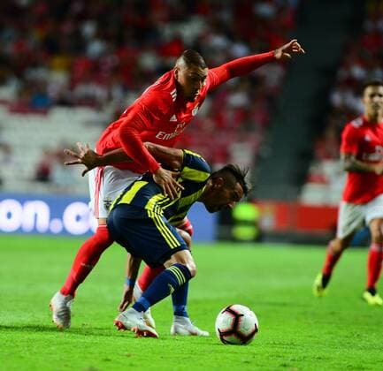Nicolas Castillo 30 of Benfica and Mauricio Isla of Fenerbahce during the Champions League Qualifying 3rd Round first leg match between Benfica and Fenerbahce at Estadio da Luz Stadium in Lisbon , Portugal on August 07 , 2018. 