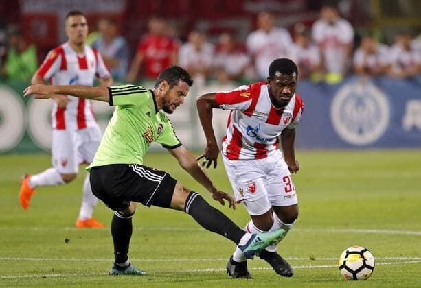 (180808) -- BELGRADE, Aug. 8, 2018 -- Spartak s Jakub Rada (L) vies with Crvena Zvezda s El Fardou Ben Nabouhane during the UEFA Champions League third qualifying round football match between Crvena Zvezda and Spartak Trnava in Belgrade, Serbia on Aug. 7. 2018. The match ended with 1-1. ) (SP)SERBIA-BELGRADE-FOOTBALL-UEFA-CHAMPIONS LEAGUE-QUALIFICATIONS PredragxMilosavljevic 