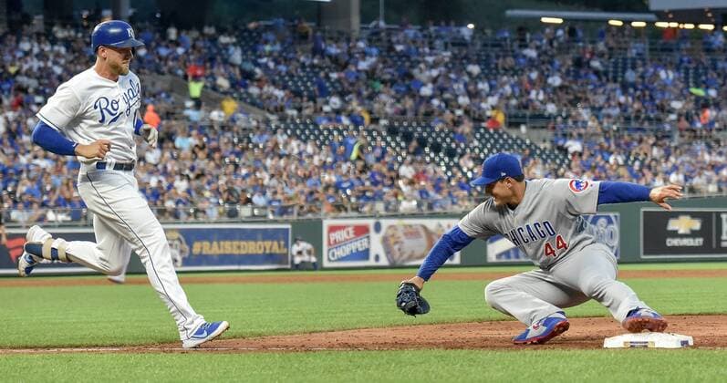 August 8, 2018 - Kansas City, MO, USA - Chicago Cubs first baseman Anthony Rizzo, right, stays on the bag long enough for a ground out on the Kansas City Royals Hunter Dozier to end the third inning on Wednesday, Aug. 8, 2018, at Kauffman Stadium in Kansas City, Mo. Chicago Cubs at Kansas City - ZUMAm67_ 20180808_zaf_m67_028 Copyright: xJohnxSleezerx