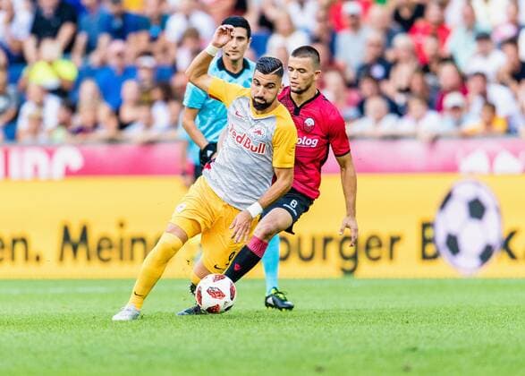 08 08 2018 Red Bull Arena Salzburg UEFA Champions League Final UEFA Championships Salzburg vs KF Shkendija Tetovo Qualification 3 Round First leg in the match v Munas Dabbur FC Salzburg Visar Musliu KF Shkendija Tetovo at the UEFA Champions League Qualifier 3rd round 1st leg match between FC Salzburg and KF Shkendija Tetovo at the Red Bull Arena in Salzburg Austria on 2018 08 08 Salzburg  EX_ADE