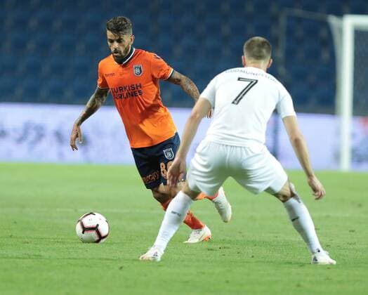 Junior Caicara of Basaksehir and Johann Gudmundsson 7 of Burnley during the UEFA Europa League Qualifying match between Basaksehir and Burnley at Basaksehir Fatih Terim Stadium in Istanbul , Turkey on August 09, 2018. 