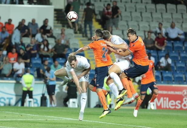 Mahmut Tekdemir 21 , Alexandru Epureanu (R) of Basaksehir and James Tarkowski 5 , Ashley Barnes 10 of Burnley during the UEFA Europa League Qualifying match between Basaksehir and Burnley at Basaksehir Fatih Terim Stadium in Istanbul , Turkey on August 09, 2018. 