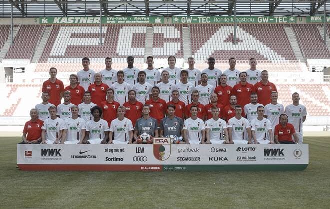 FC Augsburg 1907 1 BL Portrait date 2018 2019 Team photo back row v left Dong Won Ji Jeffrey Gouweleeuw Kevin Danso Rani Khedira Michael Gregoritsch Jan Ginger Callsen Bracker Sergio Cordova Julian Schieber Andre Hahn third row v left Dr Florian Elser Dr Andreas Weigel Dr Peter Stiller Team doctors Raphael Framberger Shawn Parker Simon Asta Romario Rösch Sönke Ermgassen Rehab Trainer Michael Wimmer Co Coach Zdenko Miletic Keeper Trainer Tobias Zellner Trainer Andreas Bäumler Rehabilitation and Athletic Trainer Jonas Scheuermann Assistant Coach Manuel Baum Coach Konstantinos Stafylidis Philipp Max Daniel Baier front row left Zdenek Vidrman Kit Manager Georg Teigl Martin Hinteregger Caiuby Francisco da Silva Felix Gotze Andreas Luthe Goalkeeper Fabian Giefer Goalkeeper Christoph Janker Alfred Finnbogason Jozo Stanic Kilian Jakob Salvatore Belardo Jonathan Schmid is missing