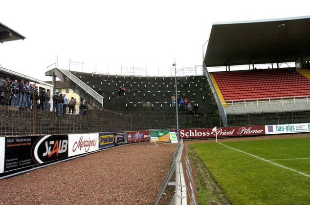 The VfB Borussia Neunkirchen jersey color white black plays in the Ellenfeld stadium in Neunkirchen against the SF Köllerbach jersey color red black on Saturday 08 12 2007 in a Oberliga encounter football Our picture shows the audience ranks and in the middle the fan curve of Borussia which today partly in protest partly because of imposed stadium bans remained empty