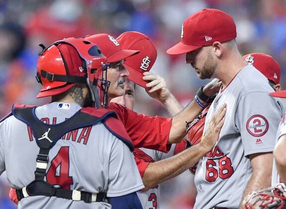 August 10, 2018 - Kansas City, MO, USA - St. Louis Cardinals pitching coach Mike Maddux pats starting pitcher Austin Gomber on the chest during a visit to the mound in the third inning against the Kansas City Royals on Friday, Aug. 10, 2018, at Kauffman Stadium in Kansas City, Mo. St. Louis at Kansas City - ZUMAm67_ 20180810_zaf_m67_025 Copyright: xJohnxSleezerx