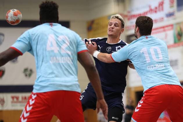 MHB Montpellier vs Fuechse Berlin Handball International Heide Cup 2018 12 08 18 Jean Loup Faustin No 25 MHB Montpellier Handball against Wael Jallouz Fuechse Berlin 42 and Jakov Gojun Nr 10 Fuechse Berlin xmmkx