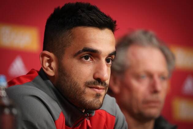 Standard s Konstantinos Laifis and Standard s head coach Michel Preud homme pictured during a press conference PK Pressekonferenz of Belgian soccer team Standard de Liege, Monday 13 August 2018 in Amsterdam, the Netherlands. The team is preparing for the return leg of the third qualifying round of the UEFA Champions League against Dutch club AFC Ajax. VIRGINIExLEFOUR  x05405453x