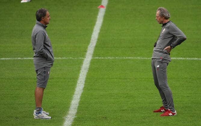 Standard s assistant coach Emilio Ferrera and Standard s head coach Michel Preud homme pictured during a training session of Belgian soccer team Standard de Liege, Monday 13 August 2018 in Amsterdam, the Netherlands. The team is preparing for the return leg of the third qualifying round of the UEFA Champions League against Dutch club AFC Ajax. VIRGINIExLEFOUR  x05405503x