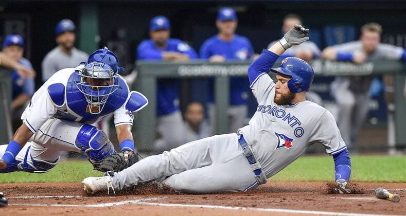 August 13, 2018 - Kansas City, MO, USA - Kansas City Royals catcher Salvador Perez, left, tags out the Toronto Blue Jays Russell Martin at home trying to score on a ground ball hit by Danny Jansen to end the top of the second inning on Monday, Aug. 13, 2018, at Kauffman Stadium in Kansas City, Mo. Toronto at Kansas City - ZUMAm67_ 20180813_zaf_m67_050 Copyright: xJohnxSleezerx