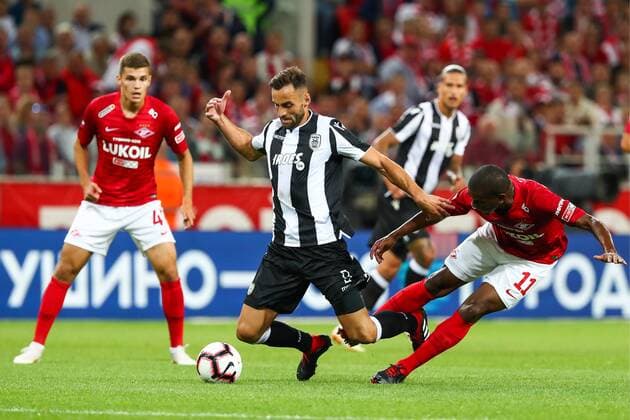 MOSCOW, RUSSIA - AUGUST 14, 2018: PAOK Thessaloniki s Jose Mauricio (C), Spartak Moscowâ€™s Roman Zobnin (L) and Lucas Fernando (R front) in their 2018-19 UEFA Champions League third qualifying round match at Moscow s Otrkitie Arena. Anton Novoderezhkin TASS  TS08CC11
