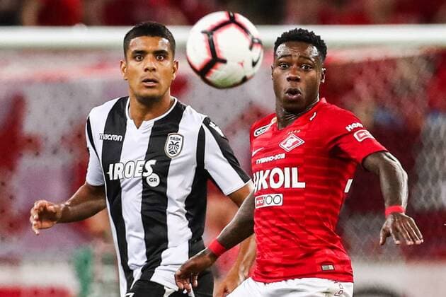 MOSCOW, RUSSIA - AUGUST 14, 2018: PAOK Thessaloniki s Leo Matos (L) and Spartak Moscowâ€™s Quincy Promes in their 2018-19 UEFA Champions League third qualifying round match at Moscow s Otrkitie Arena. Stanislav Krasilnikov TASS  TS08CC1F
