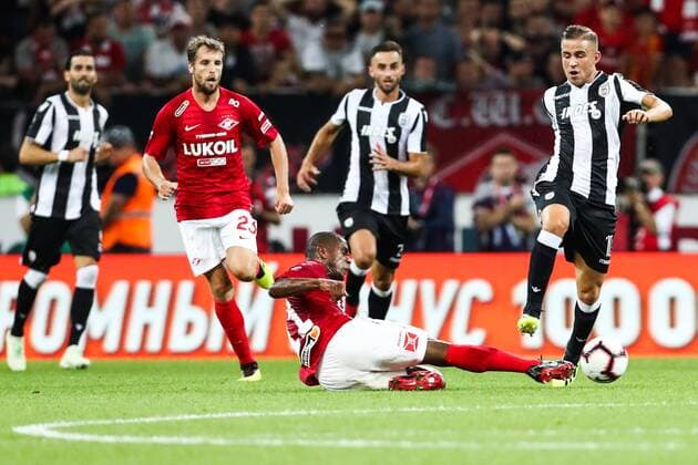 MOSCOW, RUSSIA - AUGUST 14, 2018: Spartak Moscowâ€™s Lucas Fernando, Dmitry Kombarov and PAOK Thessalonikiâ€™s Dimitris Pelkas (L-R front) in their 2018-19 UEFA Champions League third qualifying round match at Moscow s Otrkitie Arena. Stanislav Krasilnikov TASS  TS08CC21