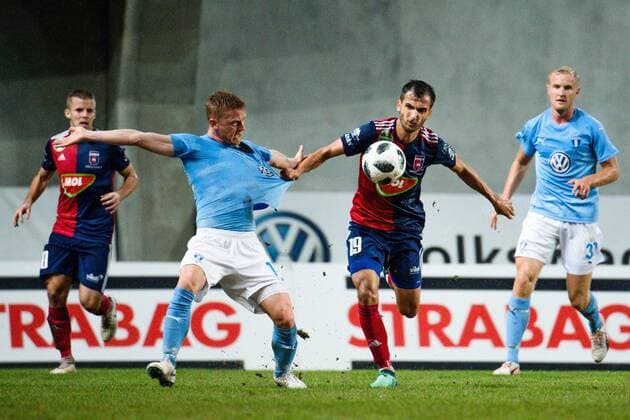 180814 Anders Christiansen or Malmö FF against Boban Nikolov or Vidi during the UEFA Champions League qualifying match between Vidi and Malmö FF on August 14, 2018 in Felcsut Photo Ludvig Thunman BILDBYR N code LT 35516  Copyright: LUDVIGxTHUNMAN BB180814LT048