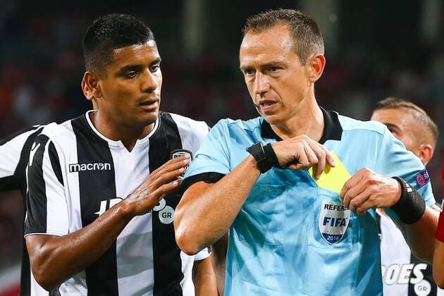 MOSCOW, RUSSIA - AUGUST 14, 2018: Referee Ruddy Buquet (R) and PAOK Thessaloniki s Leo Matos in their 2018-19 UEFA Champions League third qualifying round match against Spartak Moscow at Moscow s Otrkitie Arena. Anton Novoderezhkin TASS  TS08CC29