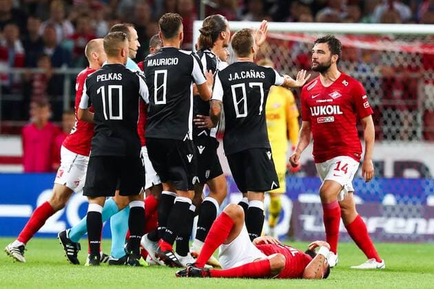 MOSCOW, RUSSIA - AUGUST 14, 2018: PAOK Thessaloniki s Dimitris Pelkas, Jose Mauricio, Jose Canas, and Spartak Moscowâ€™s Georgi Dzhikiya (L-R standing) in their 2018-19 UEFA Champions League third qualifying round match at Moscow s Otkritie Arena. Anton Novoderezhkin TASS  TS08CC2E