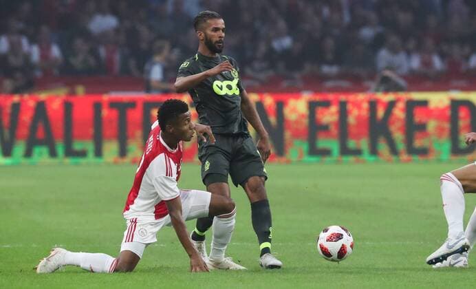 Ajax David Neres and Standard s Mehdi Carcela fight for the ball during a soccer game between Dutch club AFC Ajax and Belgian team Standard de Liege, Tuesday 14 August 2018 in Amsterdam, the Netherlands, the return leg of the third qualifying round of the UEFA Champions League. The first leg resulted in a 2-2 draw. VIRGINIExLEFOUR  x05405860x