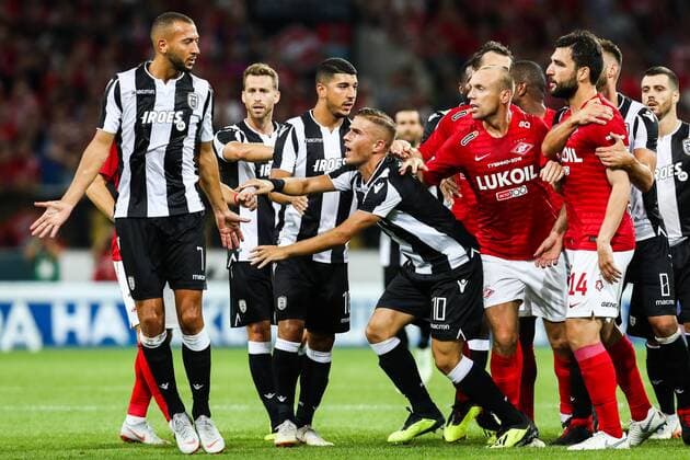 MOSCOW, RUSSIA - AUGUST 14, 2018: PAOK Thessaloniki s Omar El Kaddouri, Jose Canas, Dimitris Limnios, Dimitris Pelkas, Spartak Moscowâ€™s Denis Glushakov and Georgi Dzhikiya (L-R) in their 2018-19 UEFA Champions League third qualifying round match at Moscow s Otkritie Arena. Anton Novoderezhkin TASS  TS08CC39