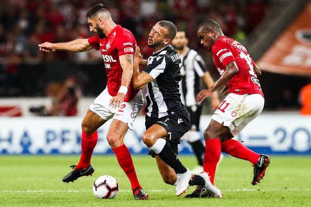 MOSCOW, RUSSIA - AUGUST 14, 2018: PAOK Thessaloniki s Omar El Kaddouri (C), Spartak Moscowâ€™s Samuel Gigot (L) and Lucas Fernando in their 2018-19 UEFA Champions League third qualifying round match at Moscow s Otkritie Arena. Stanislav Krasilnikov TASS  TS08CC37