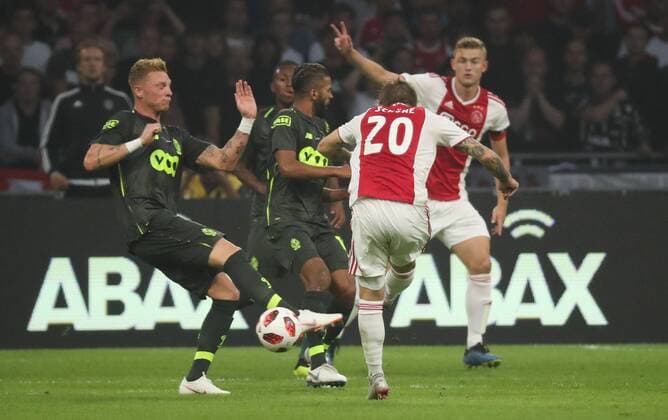 Standard s Renaud Emond and Ajax Lasse Schone fight for the ball during a soccer game between Dutch club AFC Ajax and Belgian team Standard de Liege, Tuesday 14 August 2018 in Amsterdam, the Netherlands, the return leg of the third qualifying round of the UEFA Champions League. The first leg resulted in a 2-2 draw. VIRGINIExLEFOUR  x05405867x